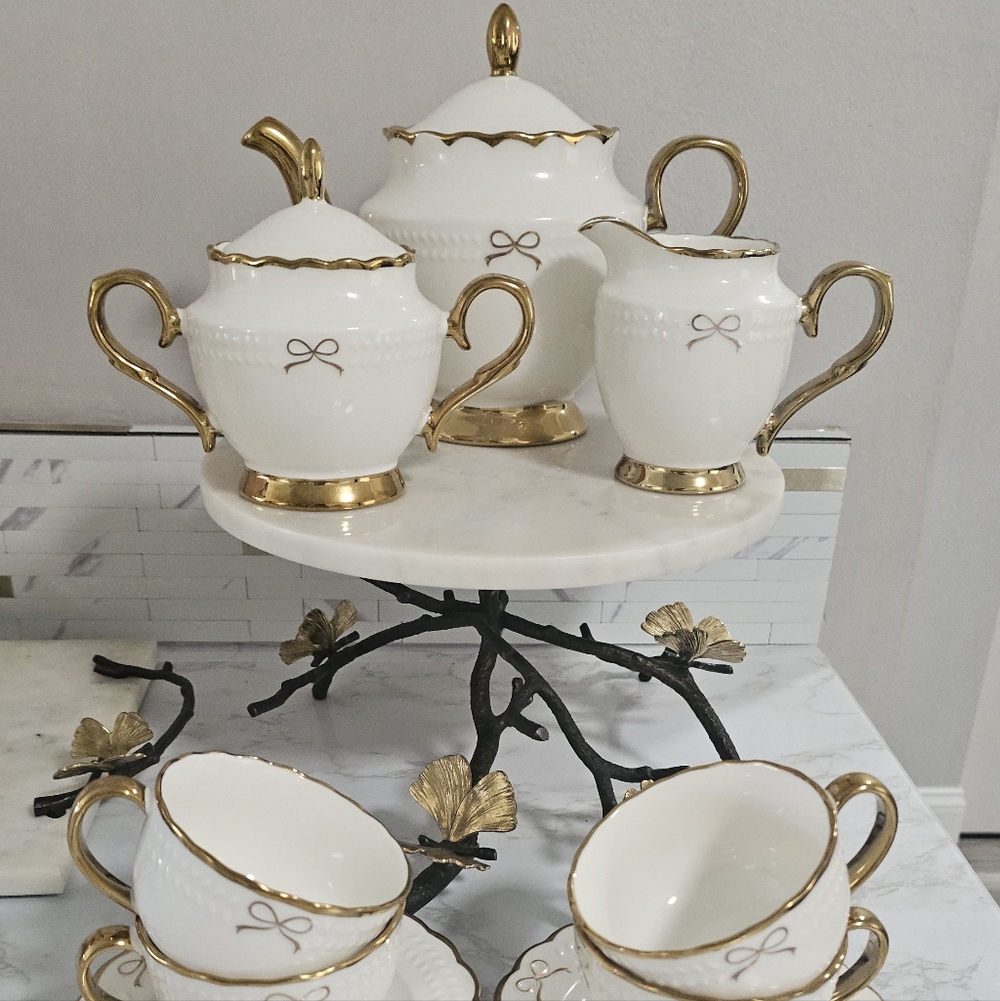 White and Gold Porcelain Tea Set with Bow Accent